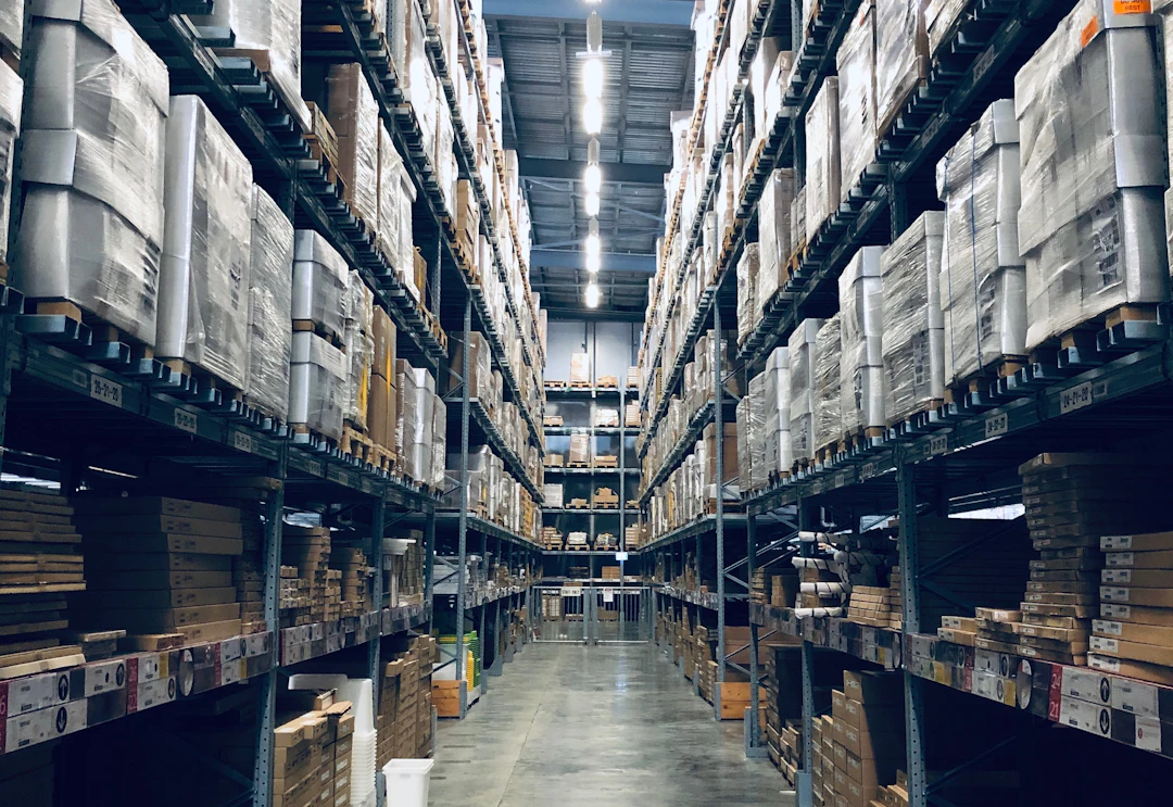 Warehouse aisle with stocked pallet racking